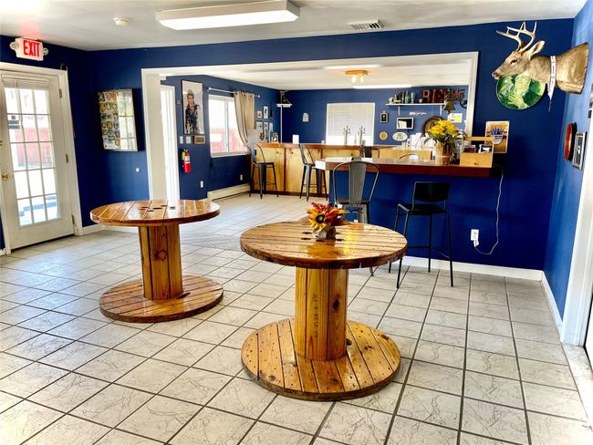 Bar featuring baseboard heating | Image 6