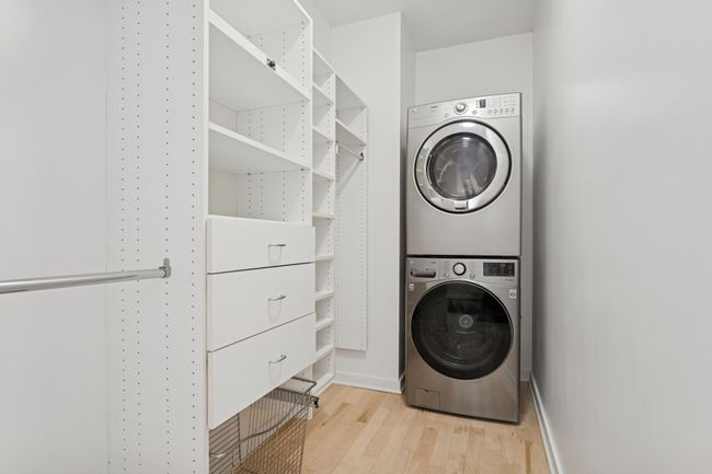 A walk-in closet with built-ins and in-suite laundry. It’s the kind of convenience that sets this home apart. | Image 20