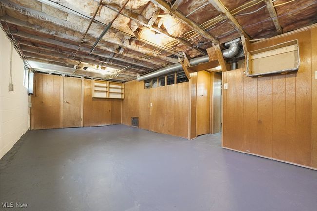 Basement featuring wood walls | Image 35