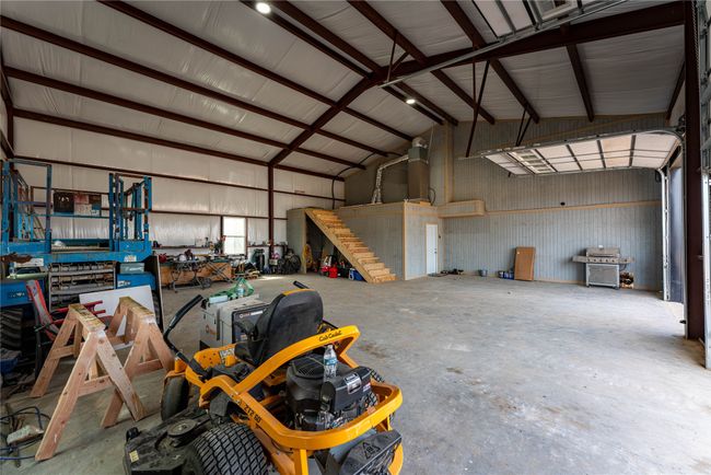 Garage featuring metal wall | Image 21