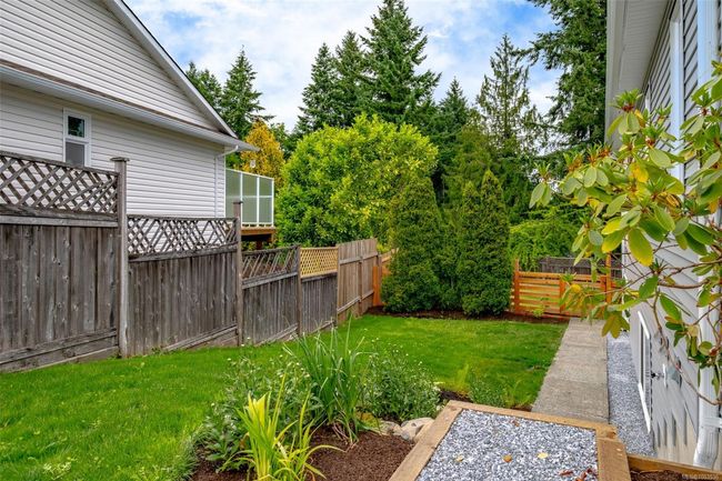 Side yard and walkway to downstairs entrance | Image 56