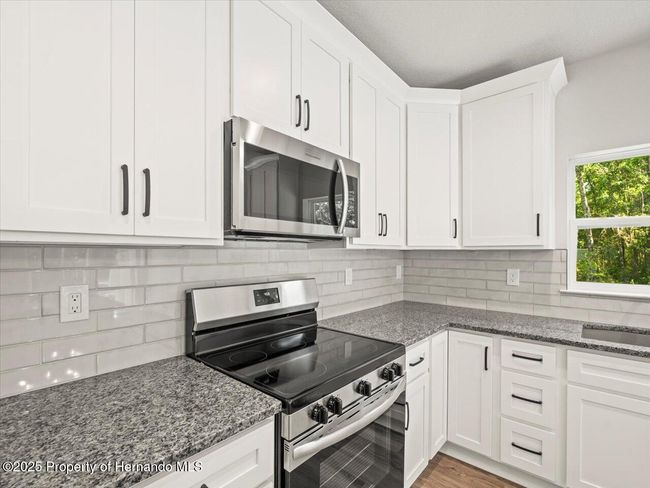 14448 Chimney Swift Rd, House other with 4 bedrooms, 2 bathrooms and null parking in WEEKI WACHEE FL | Image 4