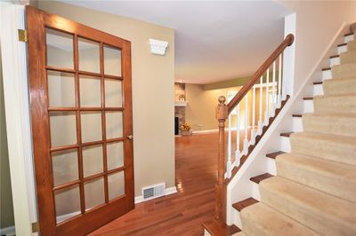 Upon stepping inside, you will enjoy a flowing layout highlighted by beautiful oak floors, sunny windows and attractive fireplace. | Image 3