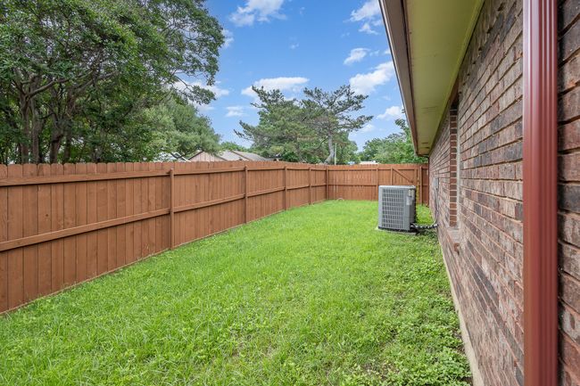 View of yard with cooling unit | Image 25