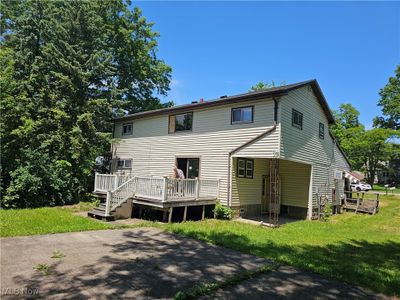 Back of property featuring a yard and a deck | Image 2