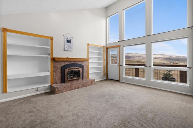 Living room w/ built-in bookcases and gas fireplace | Image 4