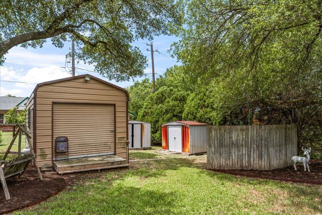 View of yard with a shed | Image 31