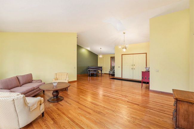 Living room w/ view to front door & sitting area | Image 10