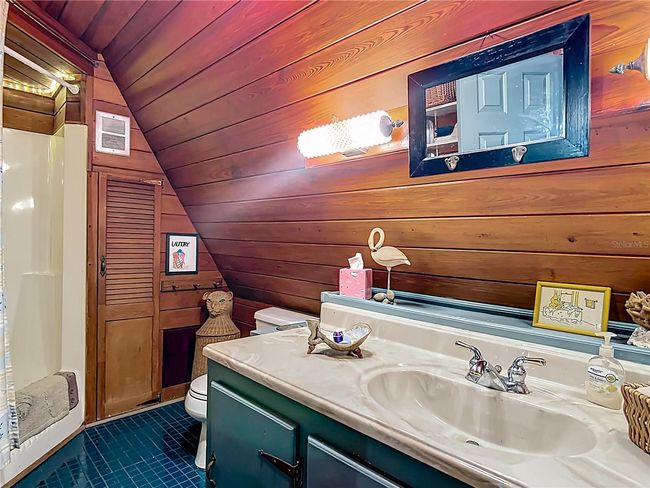 Primary bathroom has tub with shower combo, built in closets, and an oversized vanity for additional storage | Image 26
