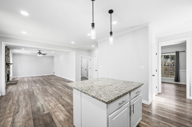 Great island space with drop lighting. | Image 34