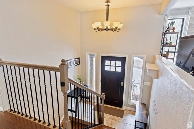 Entryway with a chandelier | Image 7