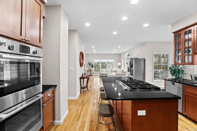 Enjoy seamless flow from kitchen to family room in this sun-drenched open-concept layout, ideal for modern living. | Image 10