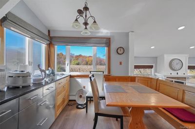 Kitchen/Dining area has large windows and a beautiful view. | Image 2