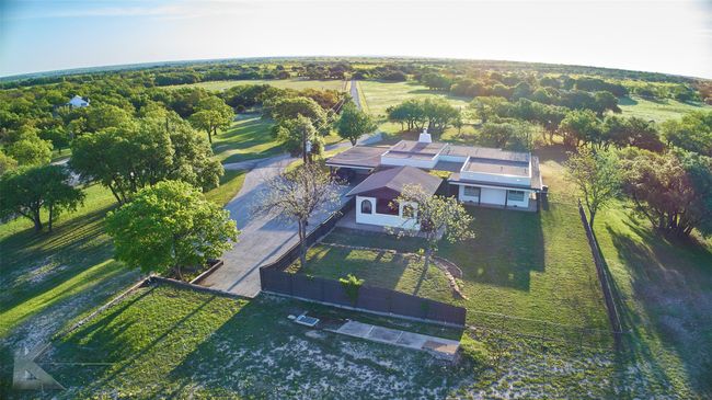 This home offers so much! Guest house, workshops, acreage, stalls, and so much more! Not to mention the views!!! Could this be your next home? | Image 40