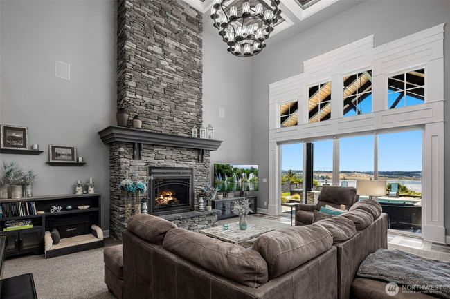 Magnificent great room with floor to ceiling fireplace and oversized windows with views of the sound and Rainier! | Image 5