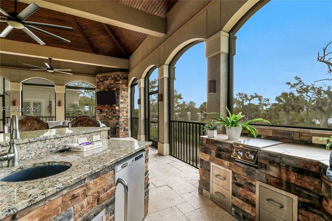 Covered lanai- outdoor kitchen & bar | Image 57