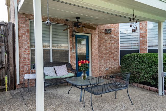 View of patio / terrace with a ceiling fan | Image 35
