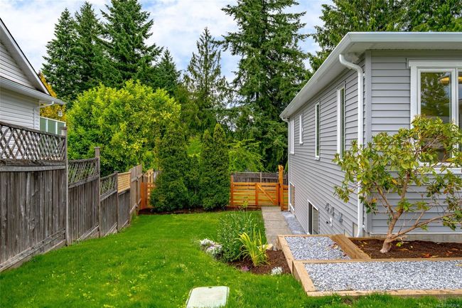 Side yard and walkway to downstairs entrance | Image 54