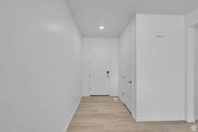 Hall featuring light wood-style floors and recessed lighting | Image 18