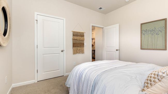 Bedroom with baseboards, carpet, and visible vents | Image 21