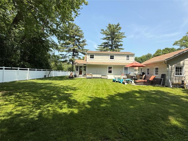 Rear view of the home and its spacious back yard. | Image 27