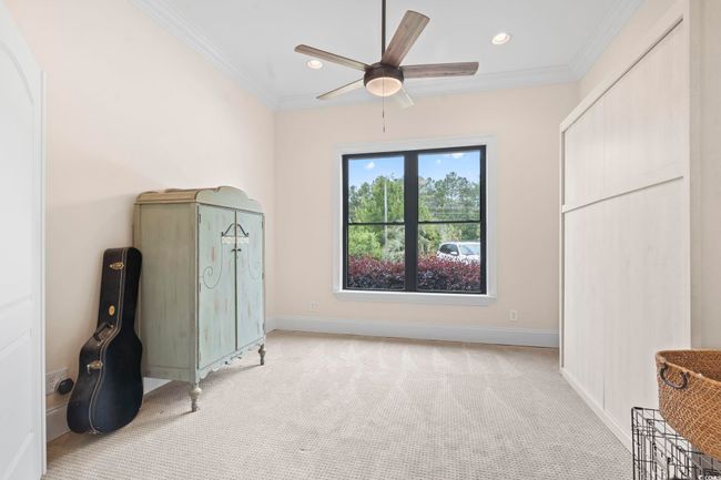 Bedroom featuring light colored carpet, crown molding, baseboards, recessed lighting, and ceiling fan | Image 28