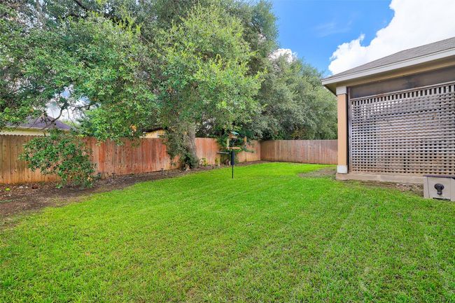 View of fenced backyard | Image 40