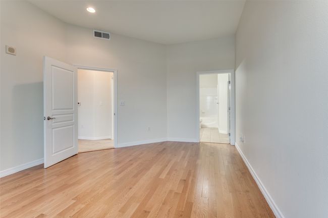There’s ample room for a king-size bed, nightstands, and a reading nook beneath the window. | Image 28