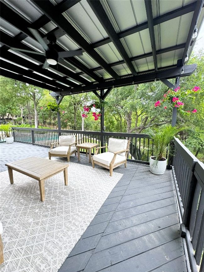 Wooden deck with a ceiling fan and a pool. | Image 38