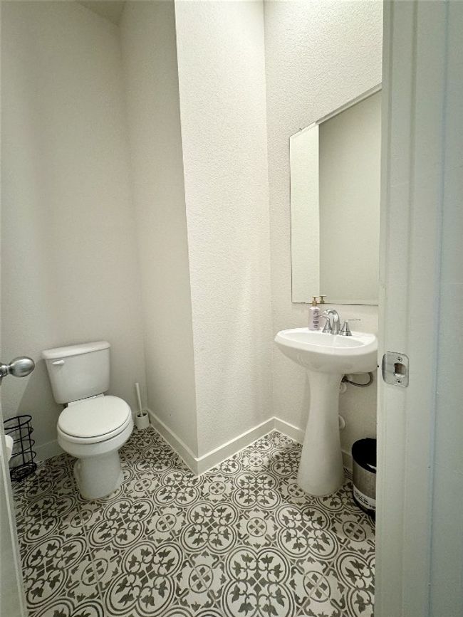 Bathroom with toilet and baseboards | Image 15