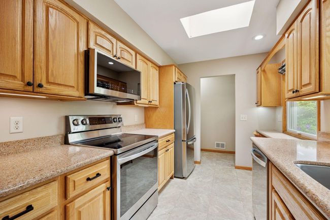 Updated skylit Kitchen with new appliances. | Image 14