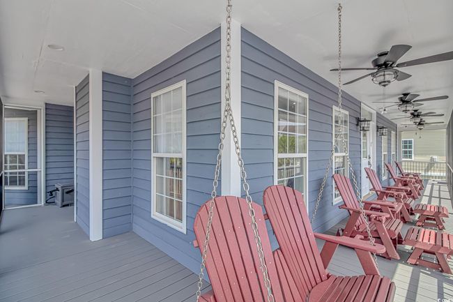 Porch featuring a ceiling fan | Image 38