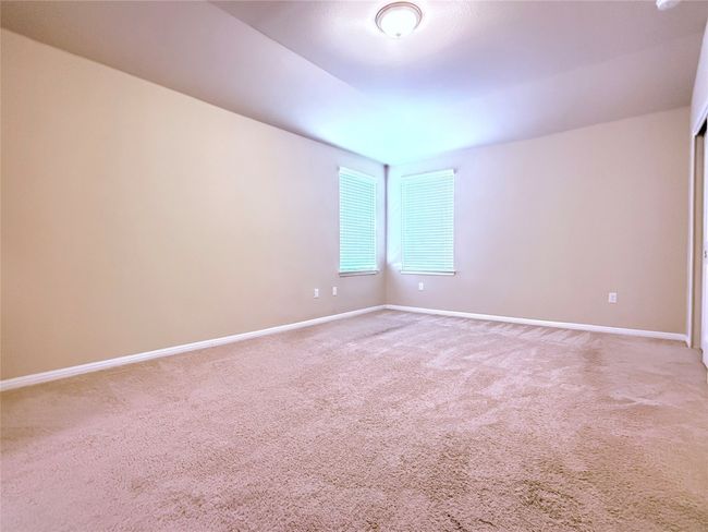 Spare room featuring carpet and baseboards | Image 17