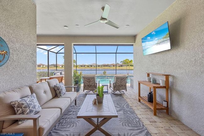 Sunroom / solarium featuring outdoor lounge area and ceiling fan | Image 37