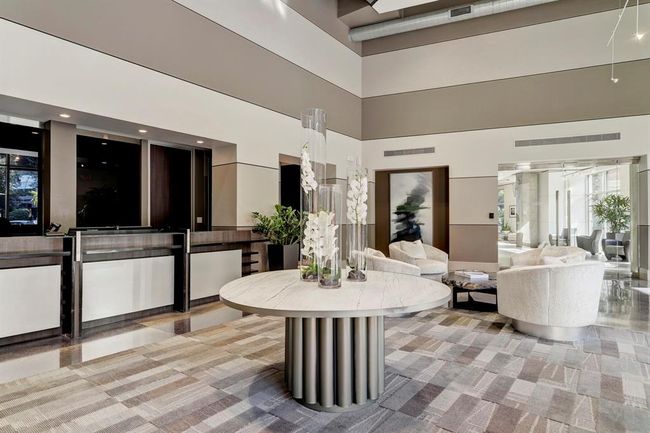 Welcoming, vibrant lobby featuring attentive front desk concierge service. | Image 16