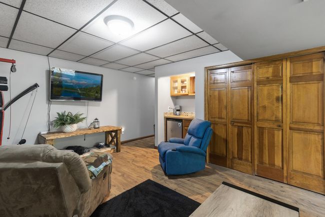 Recent improvements include a new farmhouse-style mudroom on the lower level, new landscaping, steps leading to the back deck, and an added deck off the front porch, perfect for enjoying outdoor living. | Image 31