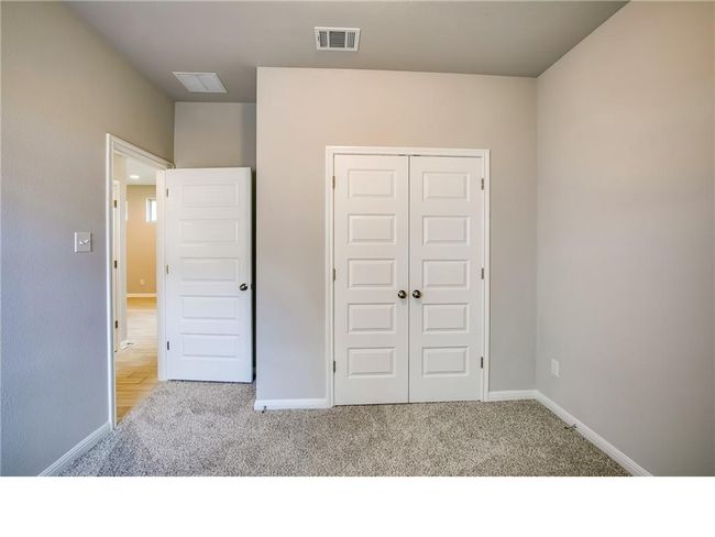 Unfurnished bedroom featuring carpet flooring and a closet | Image 19