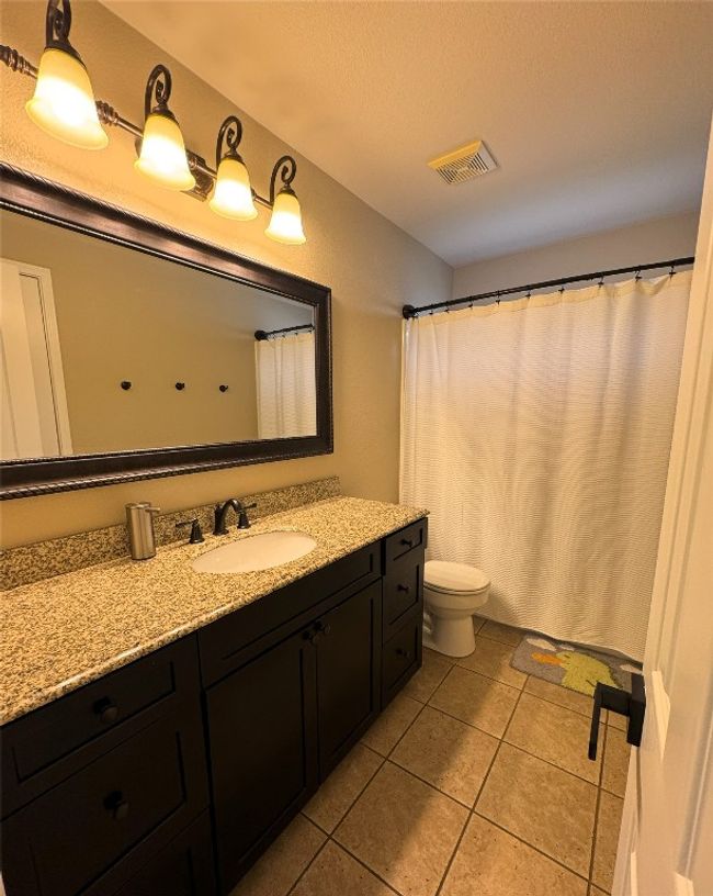 Upstairs Bathroom featuring vanity, tile patterned flooring, and curtained shower. | Image 22