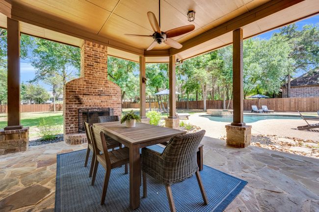 Oversized covered patio with fireplace perfect for all seasons | Image 35