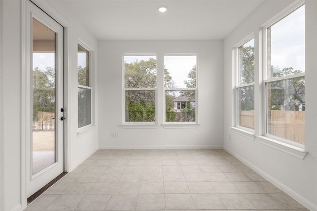 Dining room off the kitchen with access to the covered patio | Image 6