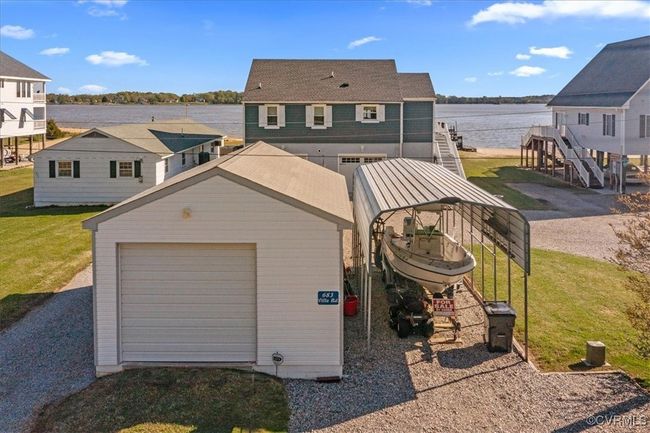 Back of house with a detached garage, plus carport for our boat/water toys. This home has it all!!! | Image 38