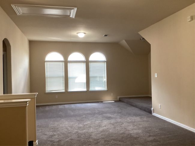 Bonus room featuring carpet floors, attic access, and baseboards | Image 23