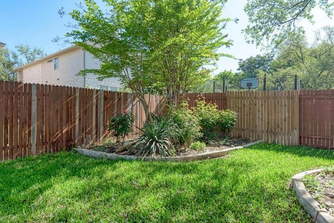View of yard with a fenced backyard | Image 36