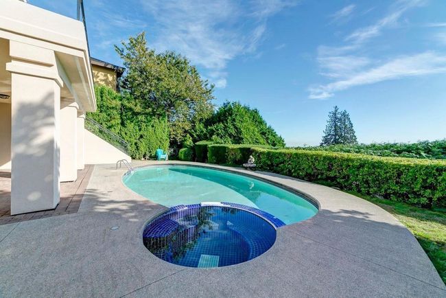 View of pool with a pool with connected hot tub and a patio area | Image 13