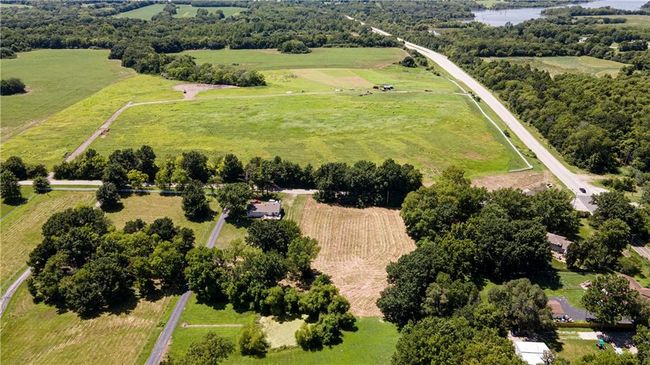Overview of rural landscape featuring a pastoral area and a large body of water | Image 5