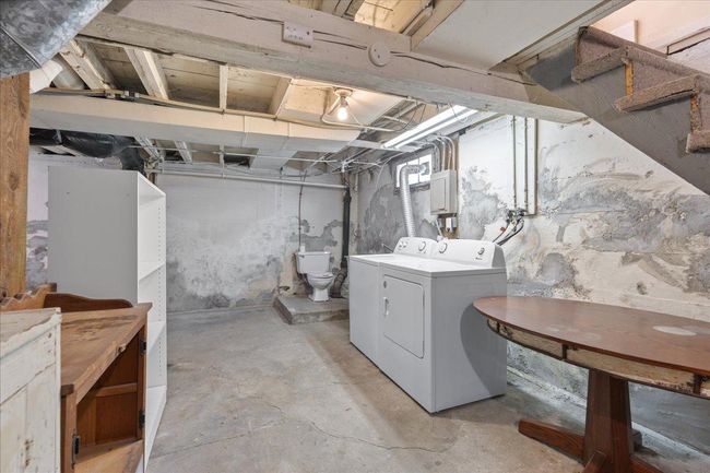 Unfinished basement with laundry and bathroom | Image 16