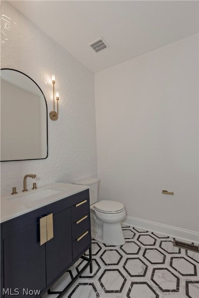 Bathroom with tile floors, toilet, and vanity | Image 30