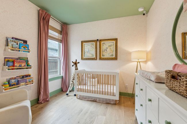 Bedroom 2 is customized as a nursery with a large walk in closet. Full bathoom located right outside the door. | Image 24