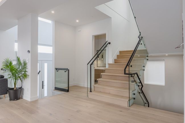 Staircase with recessed lighting, baseboards, and wood finished floors | Image 16
