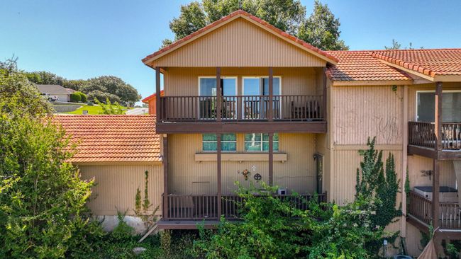 Back of house featuring a balcony | Image 32